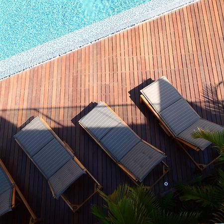 Menlyn Boutique Hotel Pretoria Exterior photo Sunloungers by a pool