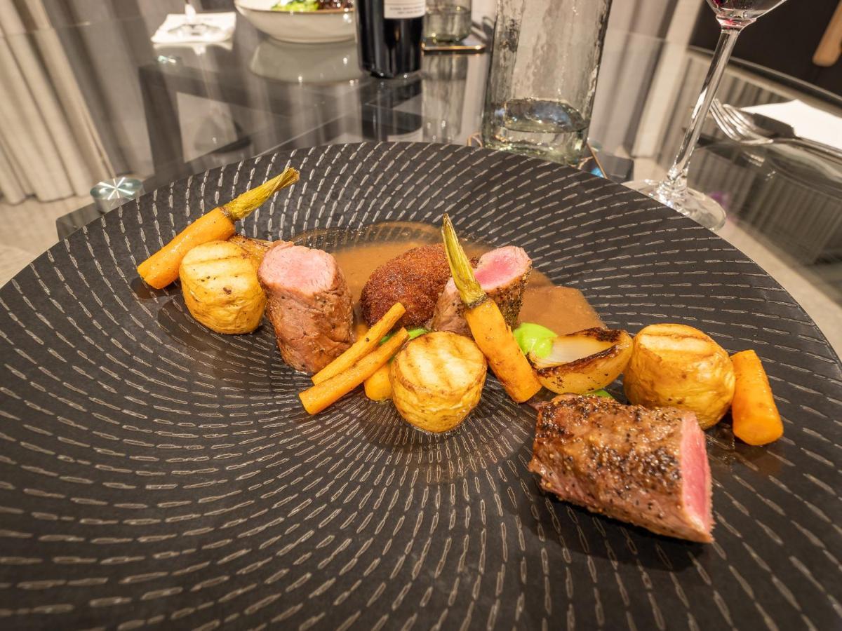 Menlyn Boutique Hotel Pretoria Exterior photo A plate of food