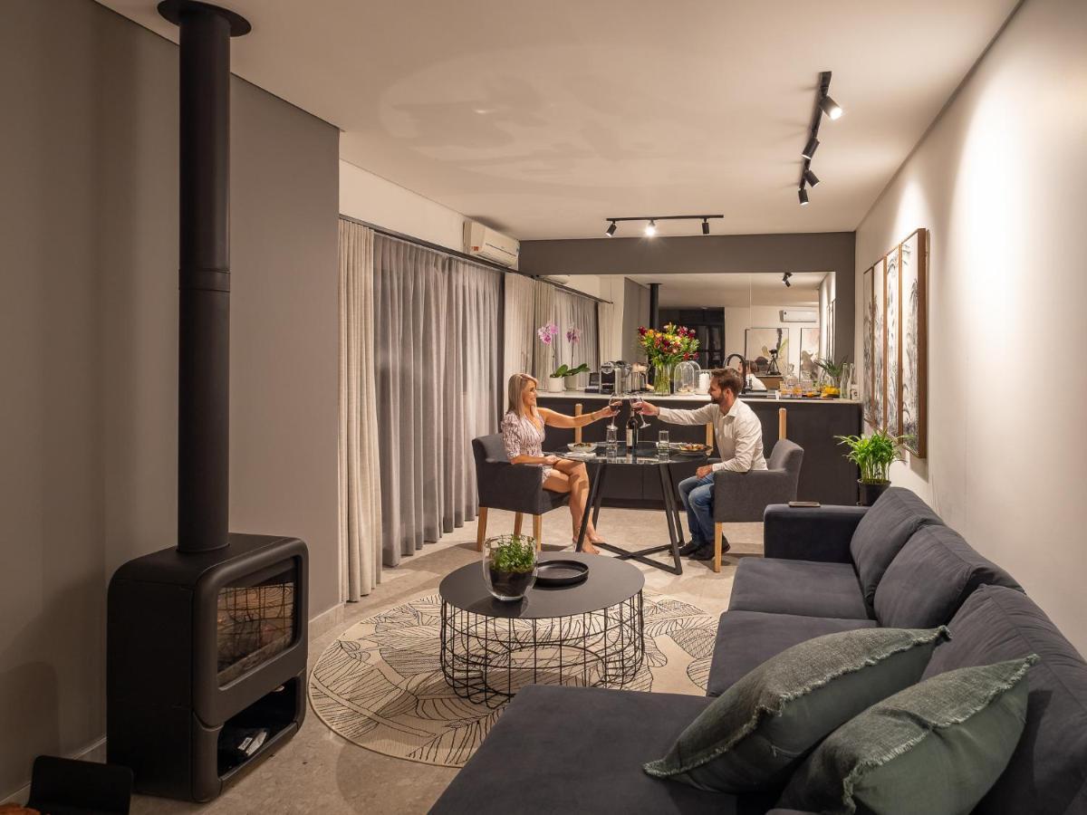 Menlyn Boutique Hotel Pretoria Exterior photo A living room with a fireplace